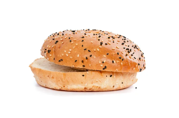 Burger bun with sesame seeds on white background — Stock Photo, Image