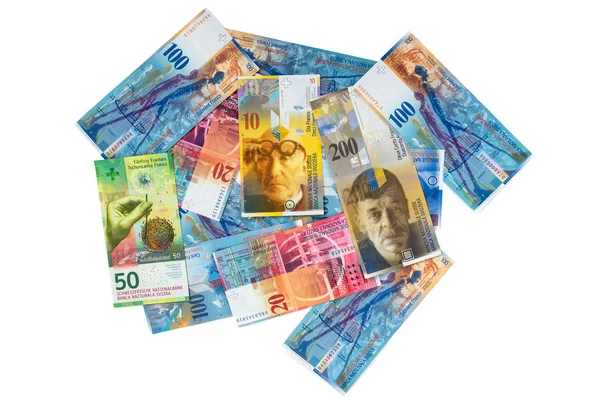 Högen av schweiziska franc sedlar på vit bakgrund — Stockfoto