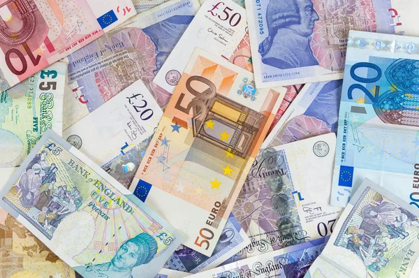 Libras esterlinas y antecedentes de billetes en euros Imágenes De Stock Sin Royalties Gratis