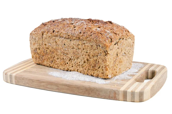 Pane integrale su un tagliere — Foto Stock