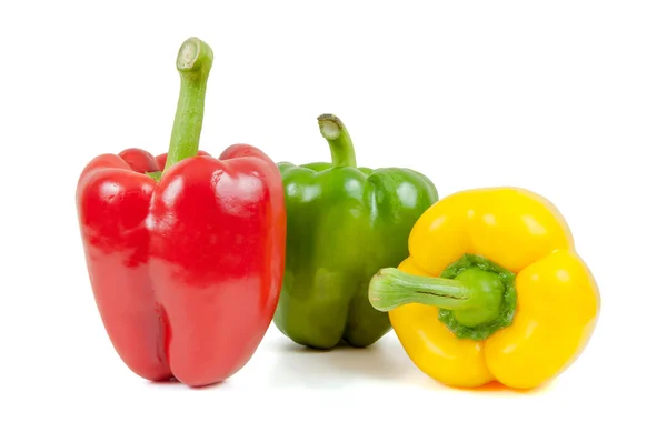 Three colored peppers on white background Stock Photo