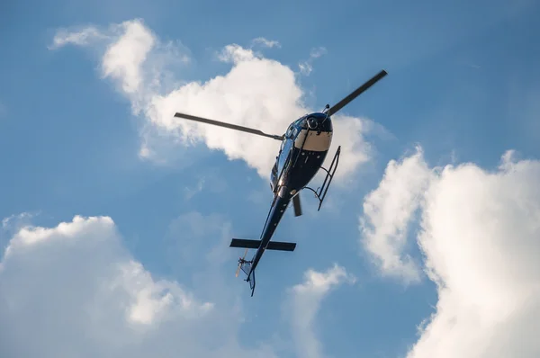 Blue helicopter in the air — Stock Photo, Image