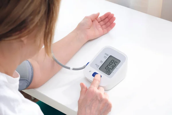 Adult Woman Measures Blood Pressure White Background Arterial Hypotension — Fotografia de Stock