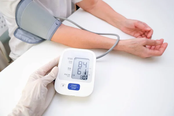 Doctor Gloves Measures Blood Pressure Person White Background Arterial Hypotension — Zdjęcie stockowe