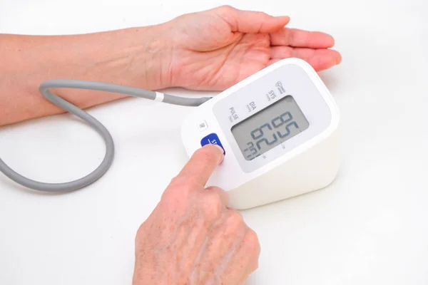 Man Measures Blood Pressure White Background Arterial Hypotension Hand Tonometer — Stock Photo, Image