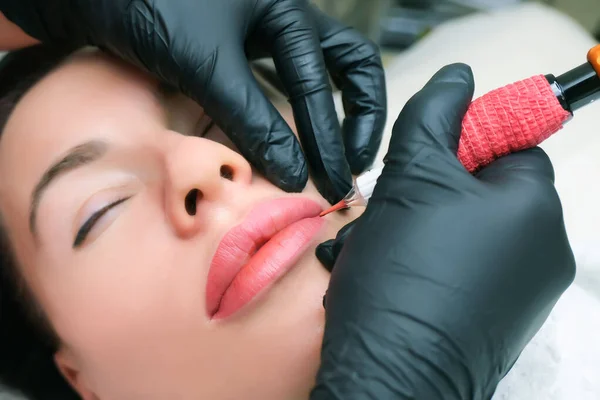 Close up of permanent lip makeup. lip tattoo. Beautiful lips