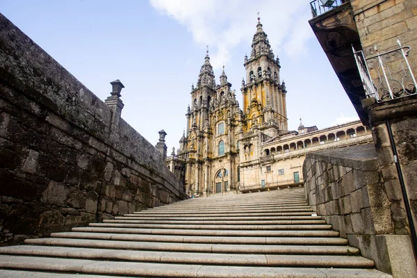 stone staircase with the facade of the cathedral of Santiago de Compostela in the background