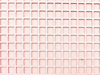 Tekrarlanan bir şebeke deseni içeren pembe duvar geometrik kare şekiller ve almassora, İspanya 'daki Fransisco Pizarro' da yer alan tekdüze çizgilerle dokulu bir arkaplan oluşturuyor.