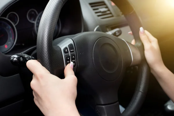 Female hands on steering wheel — Stock Photo, Image