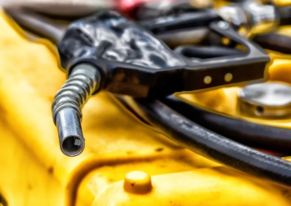 Fuel nozzle on tank — Stock Photo, Image