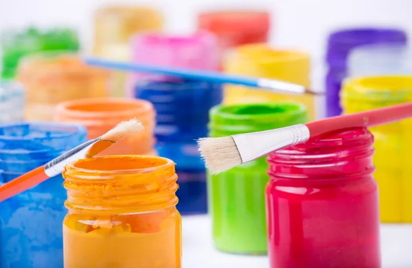 Paint in glass jars and brush — Φωτογραφία Αρχείου