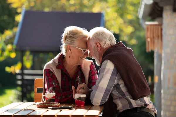 Romantic Senior Couple Sitting Garden Table Drinking Coffee Flirting — Stock Photo, Image