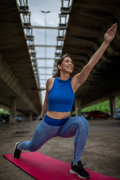 Young Woman Standing Bridge Stretching Arms Overhead Flexible Athlete  Exercising Stock Photo by ©budabar 476099732