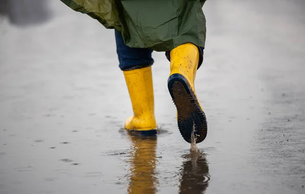 Close Farmer Legs Yellow Gumboots Green Raincoat Walking Puddles Rain — Stock Photo, Image