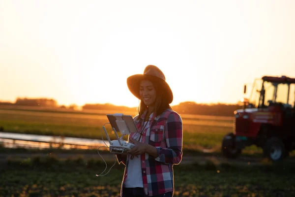 Young Female Agronomist Surveying Land Drone Sunset Farmer Standing Field — Stok fotoğraf