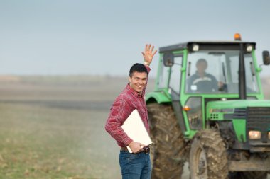 Enthusiastic farmer on farmland