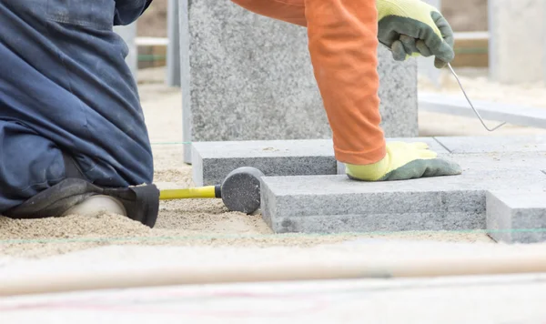 Paver working on knees — Stock Image Paver working on knees Stock Image