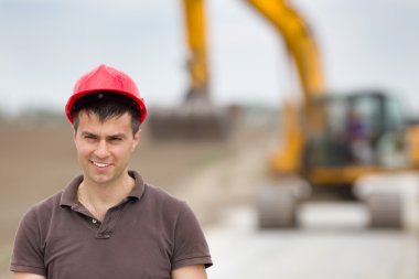 Engineer on road construction site clipart