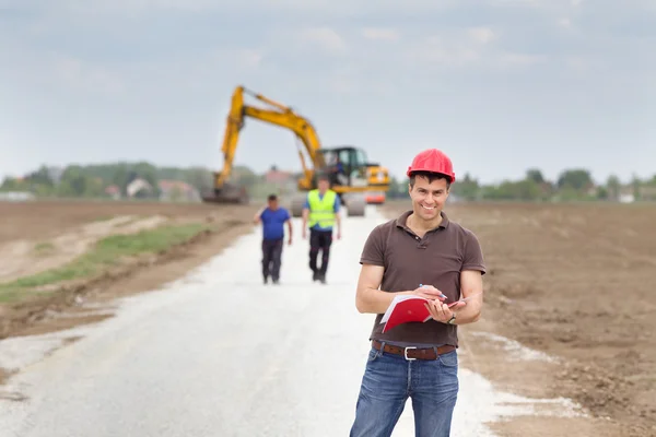 Engineer on road construction site — Stock Photo, Image