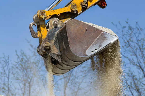 Excavator bucket with gravel — Stock Photo, Image