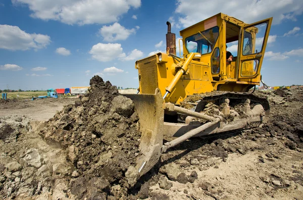 Bulldozer working at construction site — Stock Photo, Image