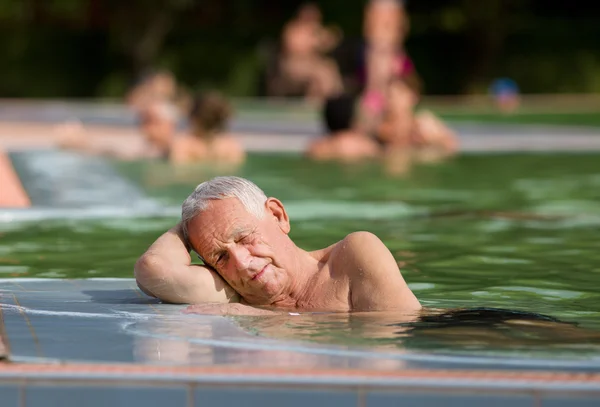 Old man in the pool — Stock Photo, Image