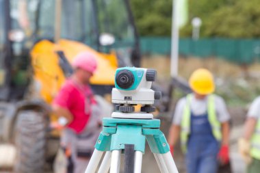Theodolite at construction site clipart