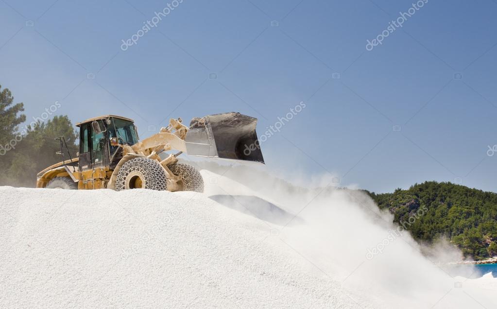 Bulldozer working at marble quarry