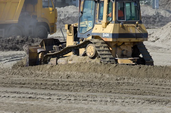 Bulldozer caterpillar on building site — Stock Photo, Image