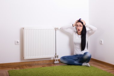 Panic emotion because of cold radiator clipart