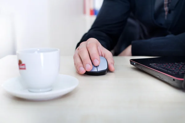 Male hand on computer wireless mouse — Stock Photo, Image