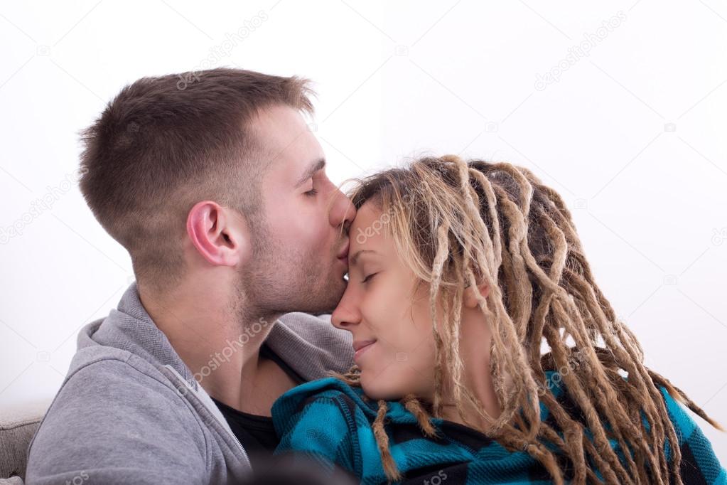 Guy kissing girl in forehead