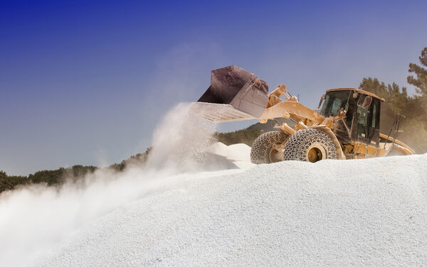 Bulldozer working at marble quarry