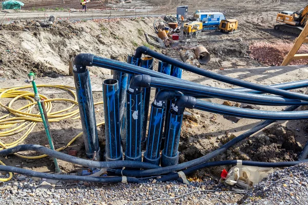 Solutions for groundwater problems using deep wells at construction site. Submersible pumps dewater foundation for a new building.