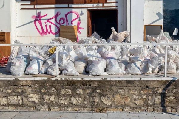 Construction waste in waste bags, material from demolished walls