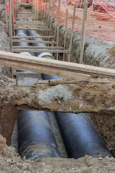 Pipes in trench — Stock Photo, Image