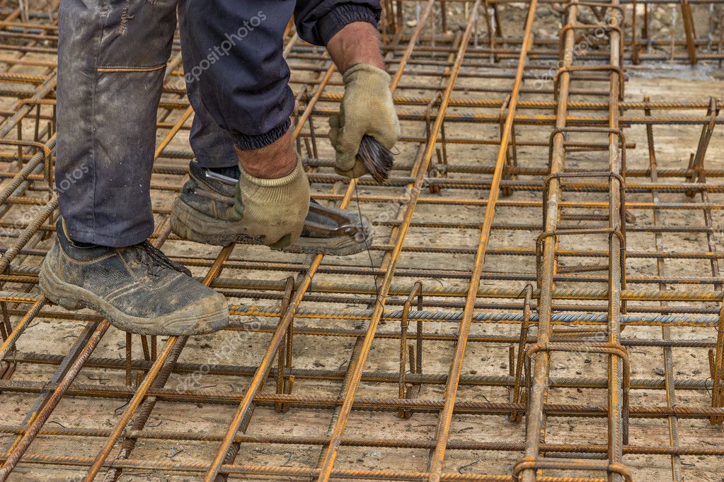 Tying rebar by hand 4 Stock Photo by ©kataklinger 54111735