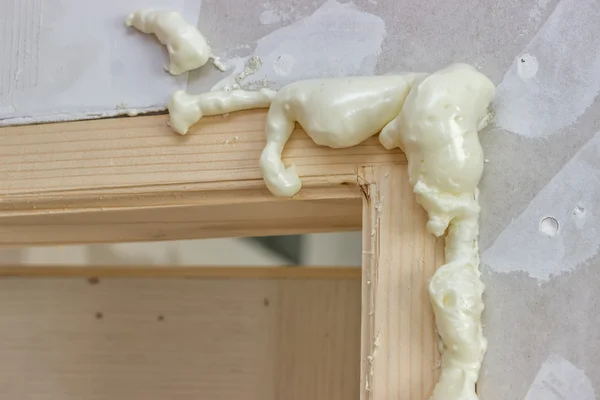 Polyurethane foam around the door frame — Stock Photo, Image