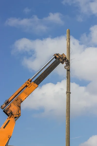 Wooden telephone pole hangs vertically 2 — Stock Photo, Image