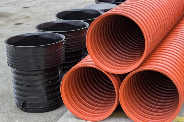 Close up of stack of underground plastic pipes — Stock Photo, Image