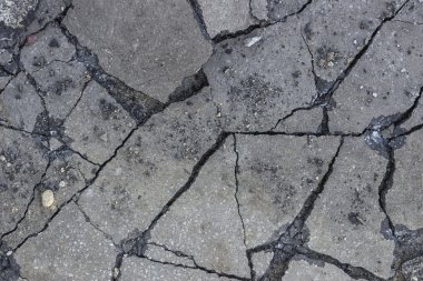 Broken asphalt after working hydraulic hammer  clipart