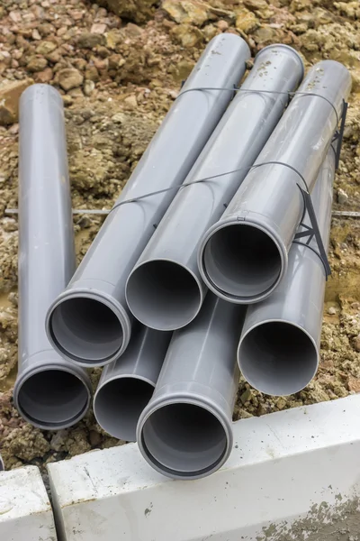 Stacks of pvc pipes at construction site — Stock Photo, Image