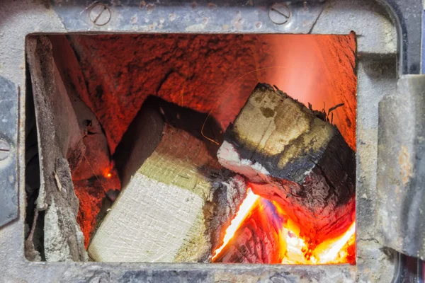 Wood stove firebox with fire and wood 3 — Stock Photo, Image