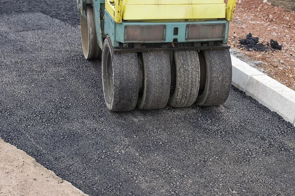 Patching asphalt at road construction site — Stock Photo, Image