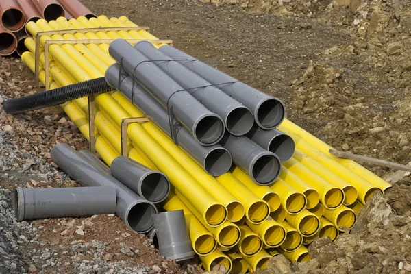 Stacks of colored pvc pipes — Stock Photo, Image