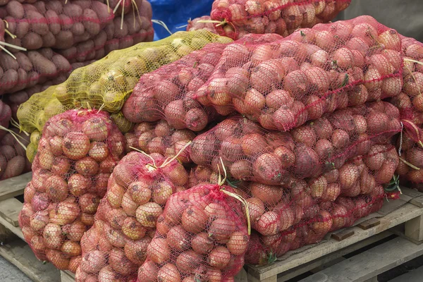 Golden onion sacks for sale 2 — Stock Photo, Image
