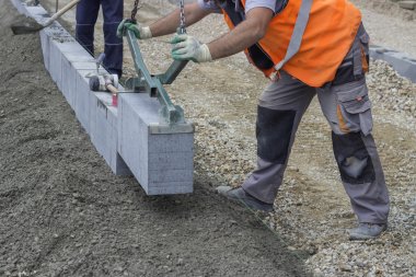 Granite curbing installation, vertical curbing clipart