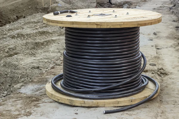 Industrial underground cable on large wooden reel — Stock Photo, Image