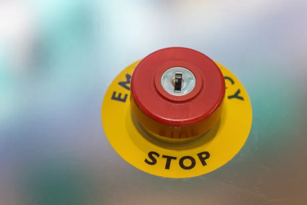 Red emergency stop button on machine for safety — Stock Photo, Image