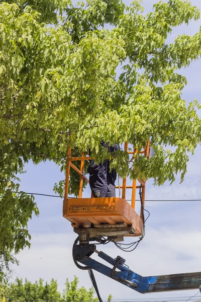 Utility worker replacing cables 2